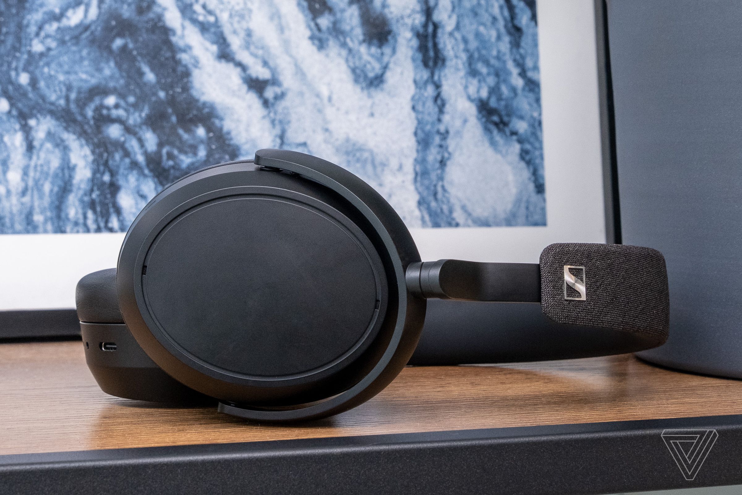 A photo of Sennheiser's Momentum 4 Wireless headphones on a table.