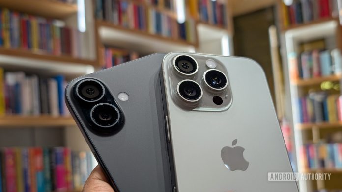 Apple iPhone 16 Plus in black color and iPhone 16 Pro in Natural Titanium color held out in hand, focusing on the camera