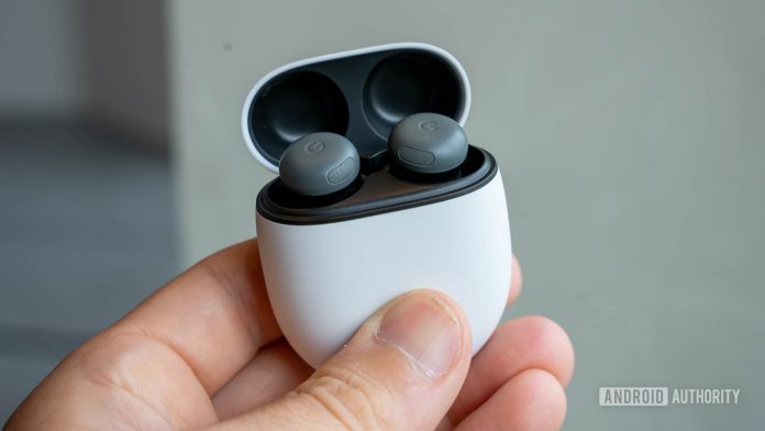 Google Pixel Buds Pro 2 in Hazel in charging case with lid open in person's left hand