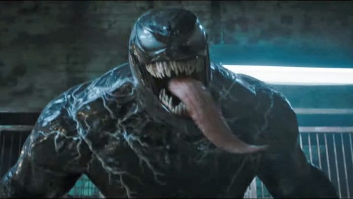 Venom roars at someone off-camera with his tongue hanging out in Venom: The Last Dance