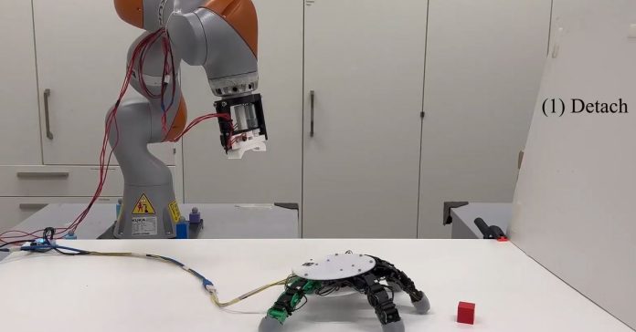 A robotic arm with its articulated hand detached and crawling on its own.