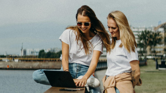 Two women looking at computer screen