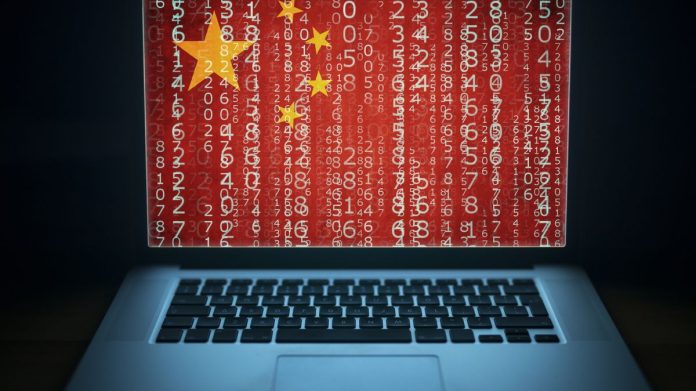 China&#039;s flag overlays laptop screen