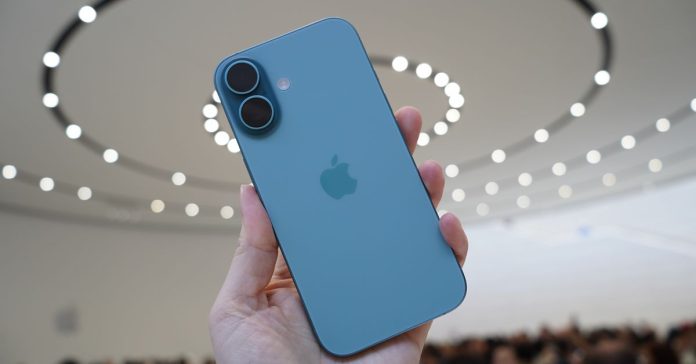 Photo of iPhone 16 in hand.