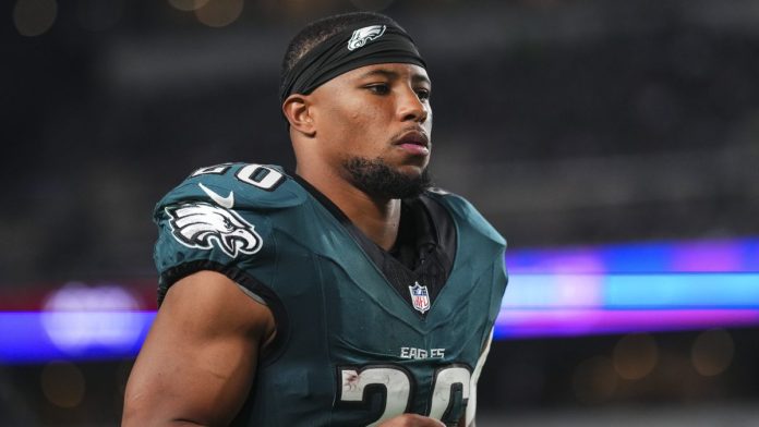 Saquon Barkley #26 of the Philadelphia Eagles runs ahead of the Eagles vs Saints live stream