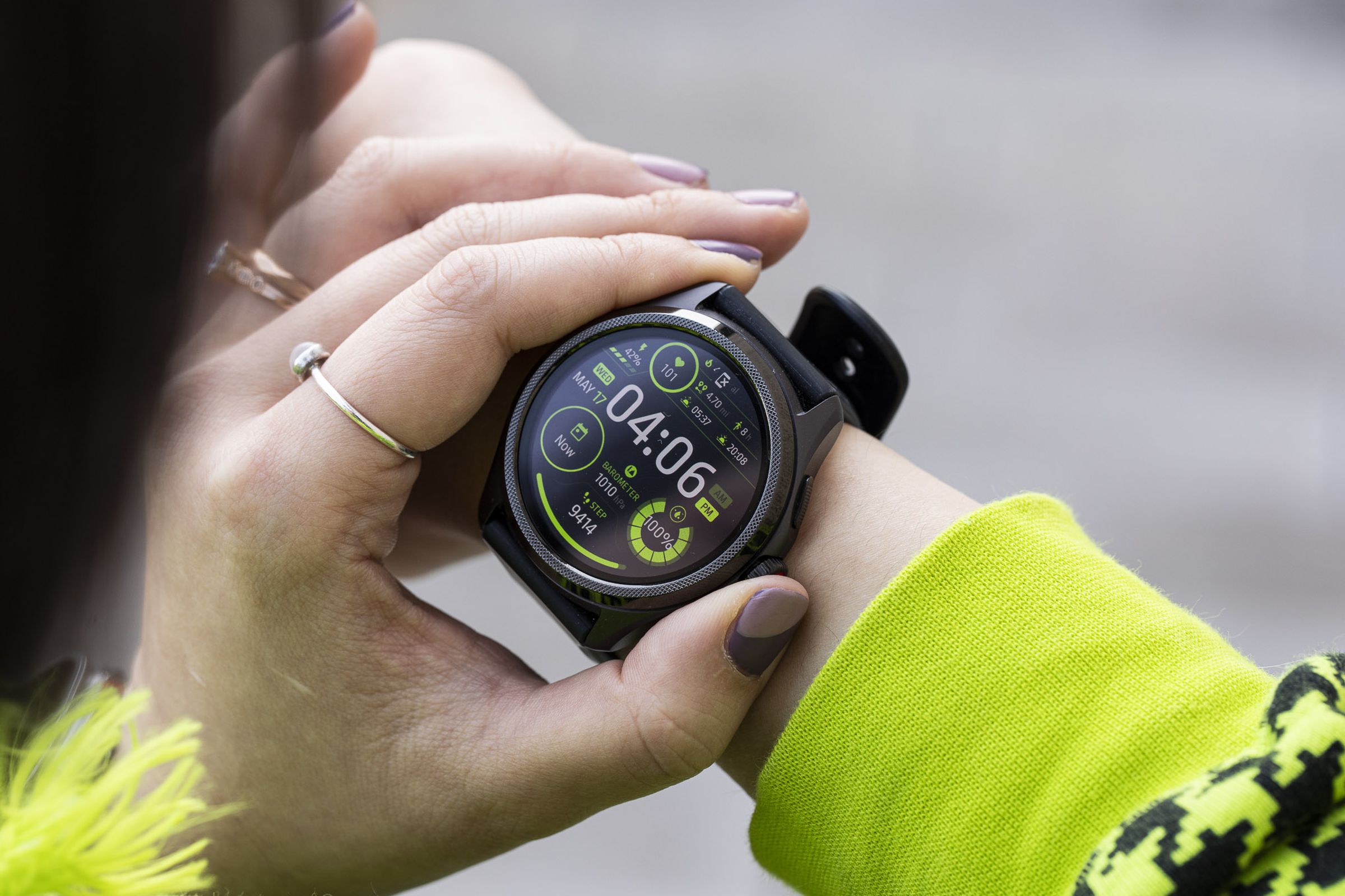 Close-up of person pressing the TicWatch Pro 5's digital crown