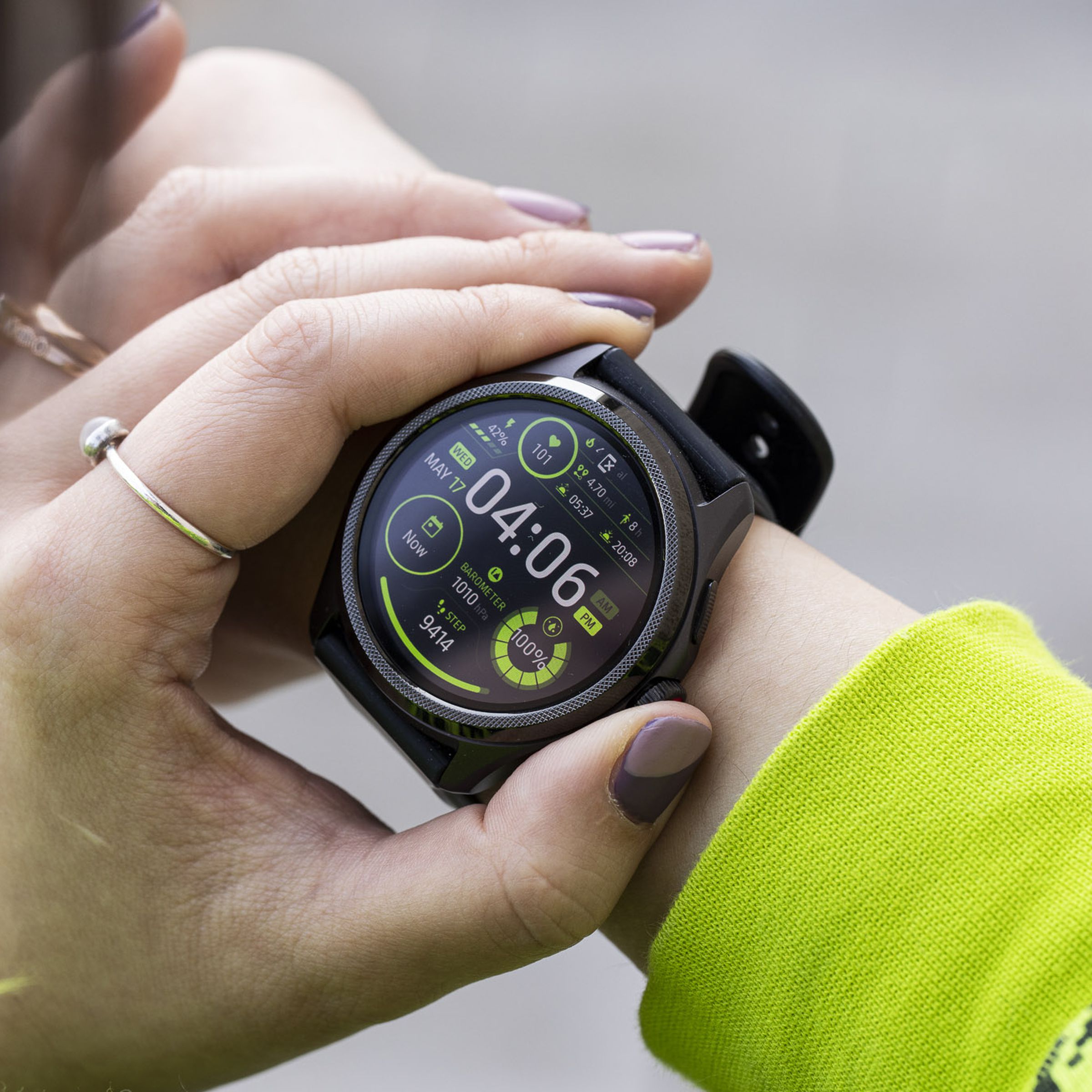 Close-up of person pressing the TicWatch Pro 5's digital crown